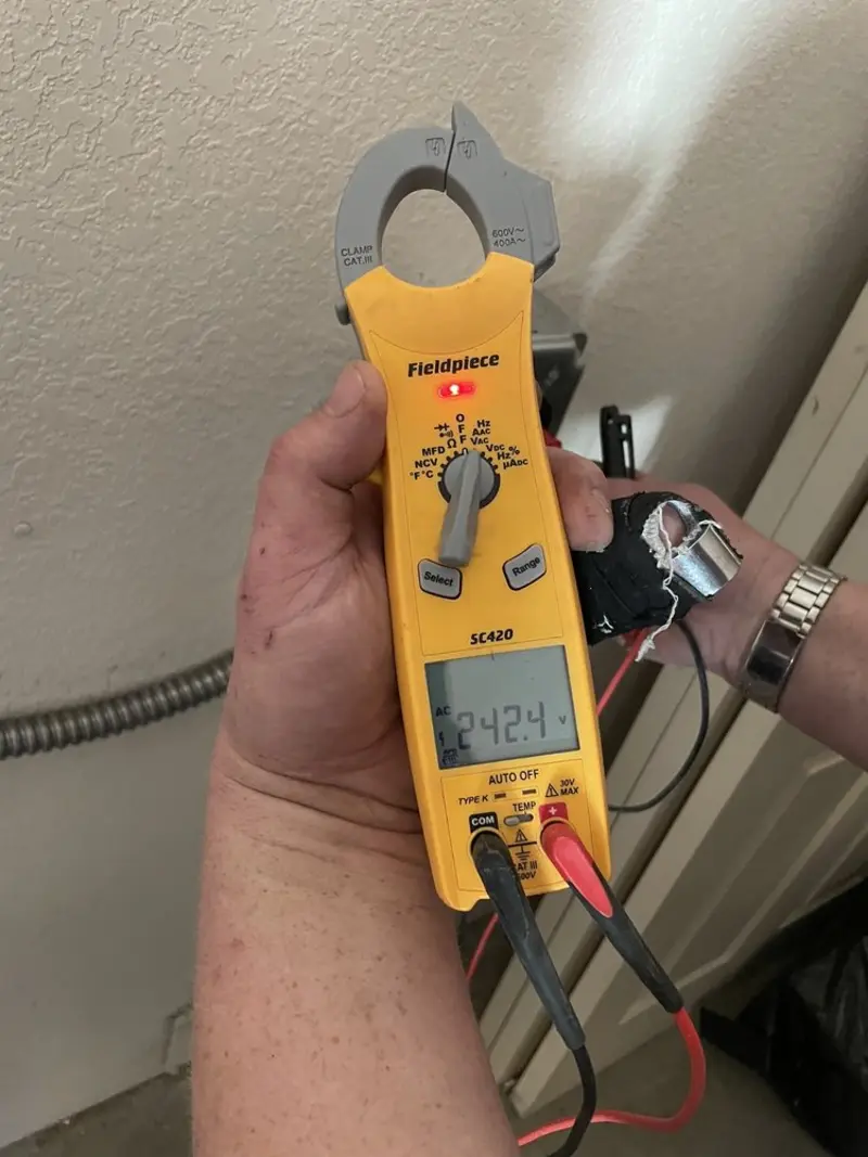 Voltage testing with clamp meter during Outlet Installation in Bay City